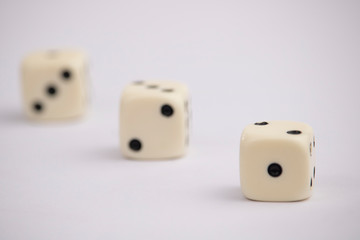 White dice with black dots in white background