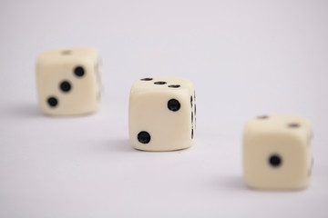 White dice with black dots in white background