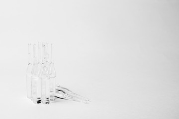 transparent medical ampoules on a white background