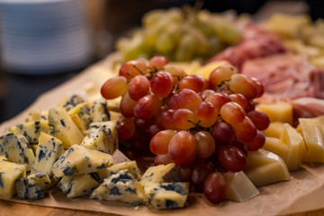 grapes and cheese on a plate
