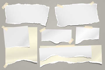 Set of torn white and yellow note, notebook paper strips and pieces stuck with sticky tape on grey background. Vector illustration
