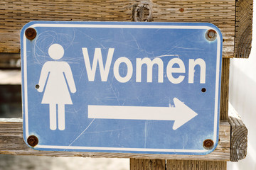 Signage at the beach showing Women's Restroom