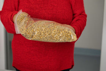 Woman opening daisies package close up