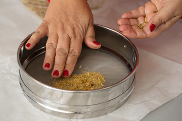 Woman with sifter close up