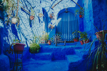 Typical moroccan building with living space in Chefchaouen blue city medina in Morocco with blue walls, doors, windows
