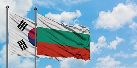 South Korea and Bulgaria flag waving in the wind against white cloudy blue sky together. Diplomacy concept, international relations.