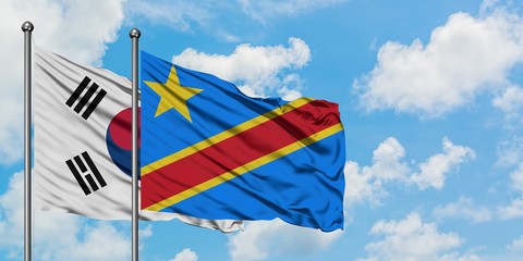 South Korea and Congo flag waving in the wind against white cloudy blue sky together. Diplomacy concept, international relations.