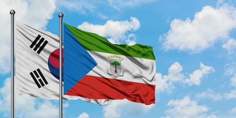 South Korea and Equatorial Guinea flag waving in the wind against white cloudy blue sky together. Diplomacy concept, international relations.