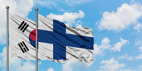 South Korea and Finland flag waving in the wind against white cloudy blue sky together. Diplomacy concept, international relations.