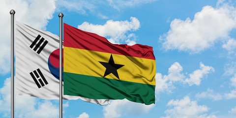 South Korea and Ghana flag waving in the wind against white cloudy blue sky together. Diplomacy concept, international relations.