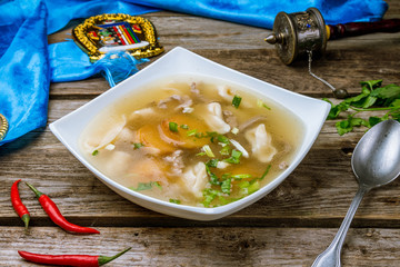 lamb noodle soup on wooden table