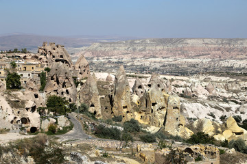 Fototapeta na wymiar Rocks of bizarre shape near the Uchisar fortress in Cappadocia,