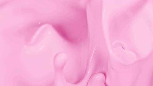 Super Slow Motion Shot of Pouring and Splashing Strawberry Milk at 1000fps.