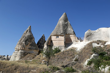 Unusually shaped volcanic cliffs in the Kaisadera Valley in the Cappadocia region of Turkey.