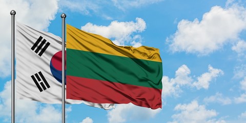 South Korea and Lithuania flag waving in the wind against white cloudy blue sky together. Diplomacy concept, international relations.