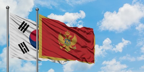 South Korea and Montenegro flag waving in the wind against white cloudy blue sky together. Diplomacy concept, international relations.