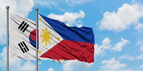 South Korea and Philippines flag waving in the wind against white cloudy blue sky together. Diplomacy concept, international relations.