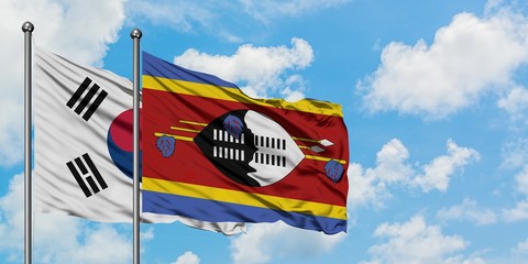 South Korea and Swaziland flag waving in the wind against white cloudy blue sky together. Diplomacy concept, international relations.