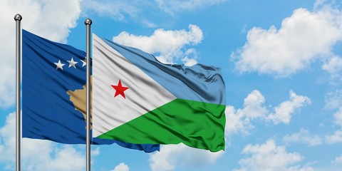 Kosovo and Djibouti flag waving in the wind against white cloudy blue sky together. Diplomacy concept, international relations.