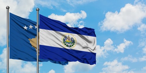 Kosovo and El Salvador flag waving in the wind against white cloudy blue sky together. Diplomacy concept, international relations.