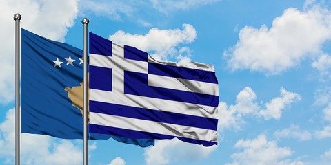 Kosovo and Greece flag waving in the wind against white cloudy blue sky together. Diplomacy concept, international relations.