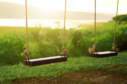 Children swing in the park