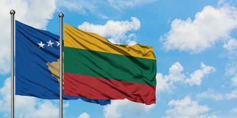 Kosovo and Lithuania flag waving in the wind against white cloudy blue sky together. Diplomacy concept, international relations.