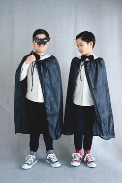 Portrait of two little boys in vampire costumes