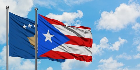 Kosovo and Puerto Rico flag waving in the wind against white cloudy blue sky together. Diplomacy concept, international relations.