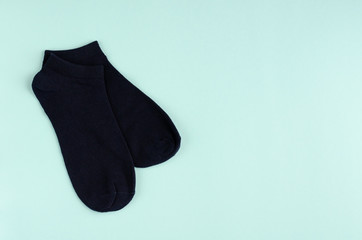 Kids socks composition on blue background. Flat lay.