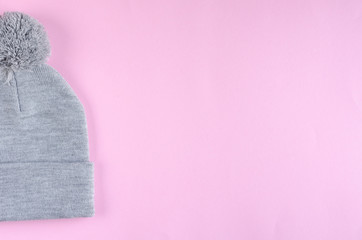 Gray cotton hat composition on pink background. Flat lay.
