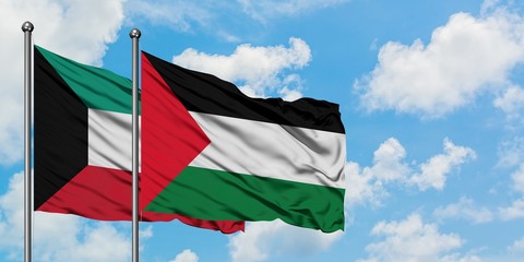 Kuwait and Palestine flag waving in the wind against white cloudy blue sky together. Diplomacy concept, international relations.