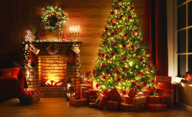 interior christmas. magic glowing tree, fireplace, gifts in  dark - Powered by Adobe