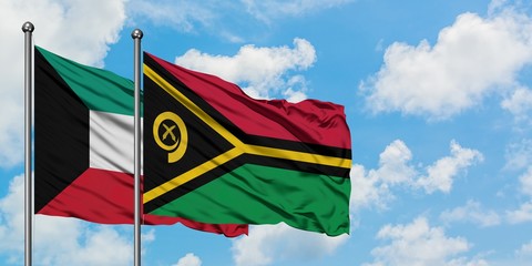Kuwait and Vanuatu flag waving in the wind against white cloudy blue sky together. Diplomacy concept, international relations.