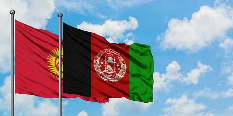 Kyrgyzstan and Afghanistan flag waving in the wind against white cloudy blue sky together. Diplomacy concept, international relations.