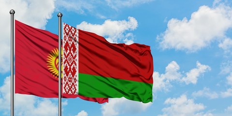Kyrgyzstan and Belarus flag waving in the wind against white cloudy blue sky together. Diplomacy concept, international relations.