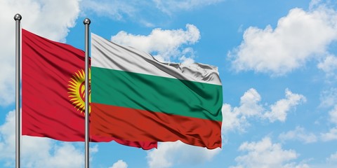 Kyrgyzstan and Bulgaria flag waving in the wind against white cloudy blue sky together. Diplomacy concept, international relations.