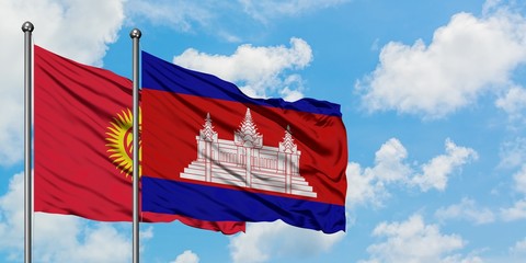 Kyrgyzstan and Cambodia flag waving in the wind against white cloudy blue sky together. Diplomacy concept, international relations.