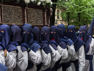 Brotherhood carrying an image in Easter week procession in Bilbao