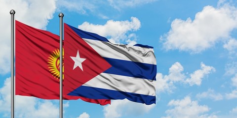 Kyrgyzstan and Cuba flag waving in the wind against white cloudy blue sky together. Diplomacy concept, international relations.