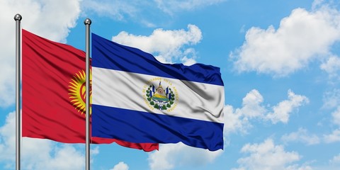 Kyrgyzstan and El Salvador flag waving in the wind against white cloudy blue sky together. Diplomacy concept, international relations.