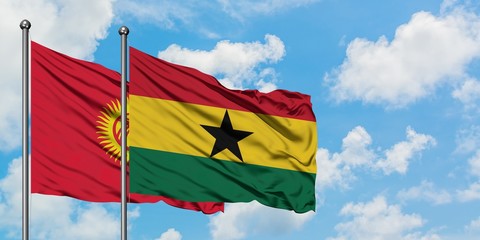 Kyrgyzstan and Ghana flag waving in the wind against white cloudy blue sky together. Diplomacy concept, international relations.