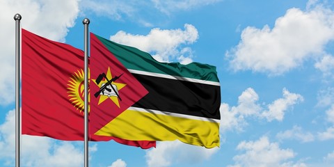 Kyrgyzstan and Mozambique flag waving in the wind against white cloudy blue sky together. Diplomacy concept, international relations.