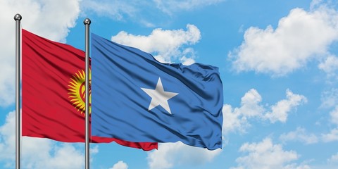 Kyrgyzstan and Somalia flag waving in the wind against white cloudy blue sky together. Diplomacy concept, international relations.