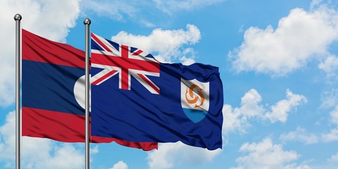 Laos and Anguilla flag waving in the wind against white cloudy blue sky together. Diplomacy concept, international relations.