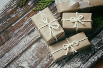 Set of parcel wrapped in craft paper and tie hemp cord. Delivery service. Online shipping. Decorative wooden background. Christmas presents concept. Many gifts.