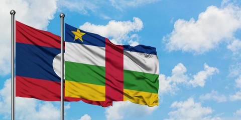 Laos and Central African Republic flag waving in the wind against white cloudy blue sky together. Diplomacy concept, international relations.
