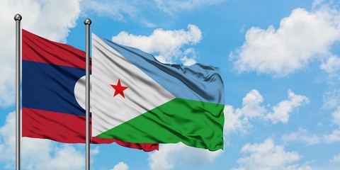 Laos and Djibouti flag waving in the wind against white cloudy blue sky together. Diplomacy concept, international relations.