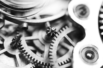 Cog wheels. black and white gears, clockwork. The concept of time, teamwork, success