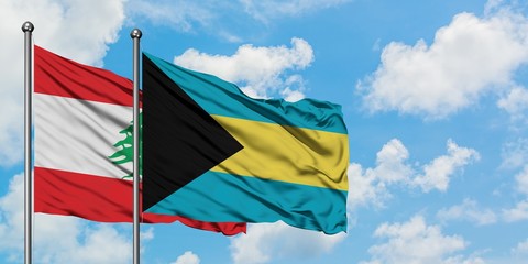 Lebanon and Bahamas flag waving in the wind against white cloudy blue sky together. Diplomacy concept, international relations.